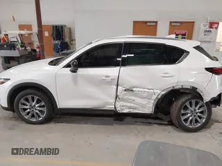 2020 Mazda CX-5 Grand Touring with VIN JM3KFBDM6L1828611, listed as a IAAI auction lot 42006976 with 59,939 mi miles and . Bid and sale history available at DreamBid. Image 15.