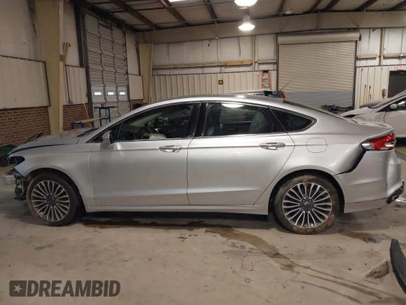2017 Ford Fusion SE z VIN 3FA6P0H95HR203170, wystawiony jako IAAI lot #41569303 z przebiegiem 143 287 mil mil oraz . Historia ofert i sprzedaży dostępna na DreamBid. Obrazek 15.