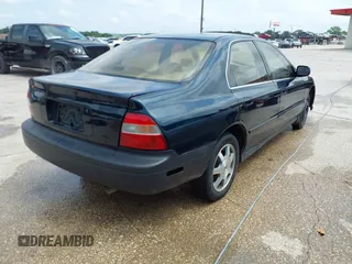 1994 Honda Accord EX with VIN 1HGCD5654RA042441, listed as a IAAI auction lot 42129570 with 121,220 mi miles and . Bid and sale history available at carsss.com. Image 4.
