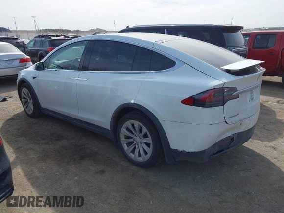 2018 Tesla Model X 75D with VIN 5YJXCBE27JF121834, listed as a IAAI auction lot 41769246 with 90,814 mi miles and . Bid and sale history available at carsss.com. Image 3.