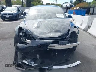 2022 Tesla Model 3 with VIN 5YJ3E1EA7NF314744, listed as a IAAI auction lot 42057596 with 30,936 mi miles and . Bid and sale history available at DreamBid. Image 12.