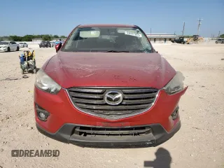 2016 Mazda CX-5 Touring with VIN JM3KE2CYXG0638247, listed as a Copart auction lot 53087305 with 0 mi miles and Salvage Title. Bid and sale history available at carsss.com. Image 5.