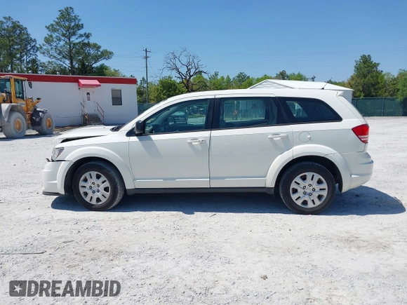 2015 Dodge Journey SE z VIN 3C4PDCAB7FT572716, wystawiony jako IAAI lot #42010091 z przebiegiem 186 489 mil mil oraz . Historia ofert i sprzedaży dostępna na DreamBid. Obrazek 13.