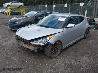 2013 Hyundai Veloster Turbo w/Black Int with VIN KMHTC6AE5DU174898, listed as a IAAI auction lot 41928271 with 119,968 mi miles. Bid and sale history available at carsss.com. Image 18.