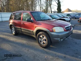 2001 Mazda Tribute LX with VIN 4F2CU08111KM19933, listed as a Copart auction lot 81174614 with 209,736 mi miles and Salvage Title. Bid and sale history available at DreamBid. Image 4.