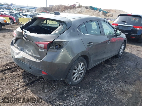 2014 Mazda 3 i Grand Touring with VIN JM1BM1M75E1207754, listed as a IAAI auction lot 41698583 with 128,887 mi miles and . Bid and sale history available at DreamBid. Image 4.