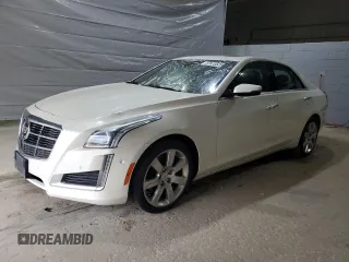 2014 Cadillac CTS Premium RWD with VIN 1G6AT5S34E0132656, listed as a Copart auction lot 57410525 with 111,934 mi miles and Salvage title. Bid and sale history available at DreamBid. Image 1.