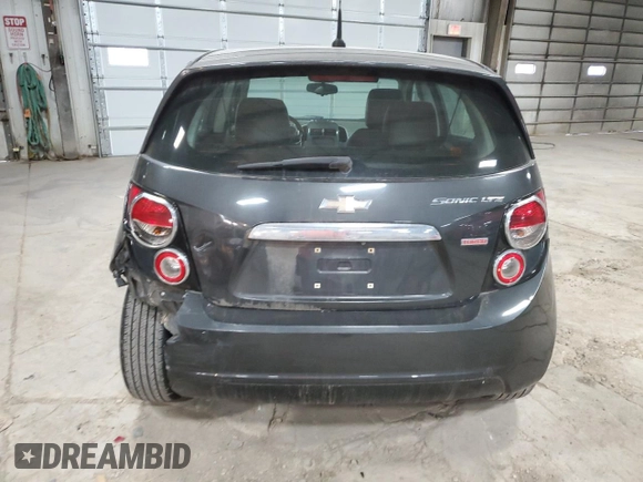 2014 Chevrolet Sonic LTZ z VIN 1G1JE6SB8E4233382, wystawiony jako Copart lot #48941115 z przebiegiem 95 876 mil mil oraz Szkoda całkowita • Salvage title. Historia ofert i sprzedaży dostępna na DreamBid. Obrazek 6.