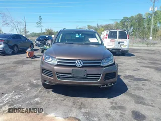 2014 Volkswagen Touareg Sport with VIN WVGEF9BP7ED003525, listed as a IAAI auction lot 41868307 with 74,379 mi miles and . Bid and sale history available at DreamBid. Image 12.