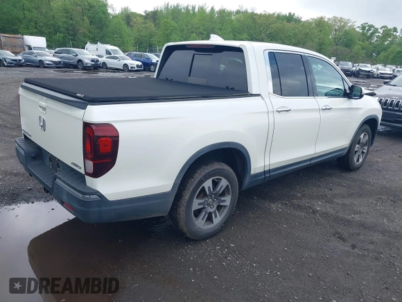 2019 Honda Ridgeline RTL-E with VIN 5FPYK3F75KB020713, listed as a IAAI auction lot 42191152 with 31,245 mi miles and . Bid and sale history available at DreamBid. Image 4.