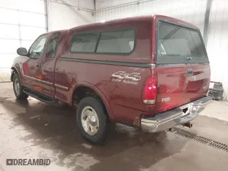 1998 Ford F-150 Standard with VIN 1FTZX18W8WKA19037, listed as a IAAI auction lot 40977819 with 137,119 mi miles. Bid and sale history available at carsss.com. Image 3.