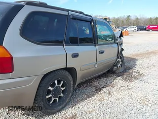 2003 GMC Envoy SLT with VIN 1GKDS13SX32203909, listed as a IAAI auction lot 41457713 with 199,507 mi miles. Bid and sale history available at carsss.com. Image 16.