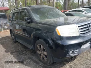 2012 Honda Pilot Touring with VIN 5FNYF4H92CB051260, listed as a IAAI auction lot 41906802 with 256,691 mi miles. Bid and sale history available at carsss.com. Image 1.