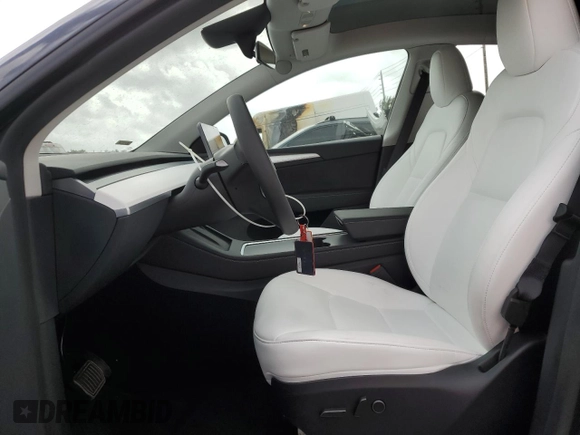 2025 Tesla Model Y Long Range with VIN 7SAYGDED6SF228626, listed as a Copart auction lot 47654525 with 2,087 mi miles and Salvage Title. Bid and sale history available at DreamBid. Image 7.