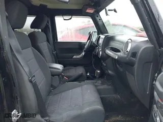 2011 Jeep Wrangler Unlimited Sahara with VIN 1J4BA5H12BL548870, listed as a IAAI auction lot 42010303 with 139,693 mi miles. Bid and sale history available at carsss.com. Image 5.