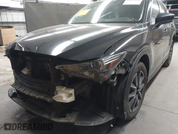 2018 Mazda CX-5 Grand Touring z VIN JM3KFADMXJ0311101, wystawiony jako IAAI lot #42163070 z przebiegiem 129 284 mil mil oraz . Historia ofert i sprzedaży dostępna na DreamBid. Obrazek 6.