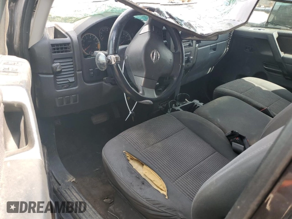 2012 Nissan Titan S z VIN 1N6AA0CJ9CN325160, wystawiony jako Copart lot #70004034 z przebiegiem 167 159 mil mil oraz Szkoda całkowita • Salvage title. Historia ofert i sprzedaży dostępna na DreamBid. Obrazek 8.