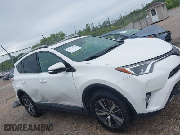 2018 Toyota RAV4 XLE with VIN 2T3WFREV4JW469929, listed as a IAAI auction lot 42536958 with 82,443 mi miles and . Bid and sale history available at DreamBid. Image 13.