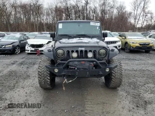 2014 Jeep Wrangler Sahara with VIN 1C4AJWBG0EL306703, listed as a Copart auction lot 51450215 with 115,932 mi miles and Salvage Title. Bid and sale history available at DreamBid. Image 5.