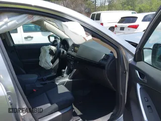 2014 Mazda CX-5 Sport with VIN JM3KE2BEXE0329303, listed as a IAAI auction lot 42556908 with 127,836 mi miles and . Bid and sale history available at DreamBid. Image 5.