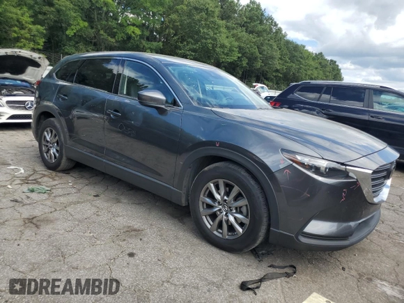 2019 Mazda CX-9 Touring with VIN JM3TCACY6K0334121, listed as a Copart auction lot 64901735 with 112,328 mi miles and Salvage title. Bid and sale history available at DreamBid. Image 4.