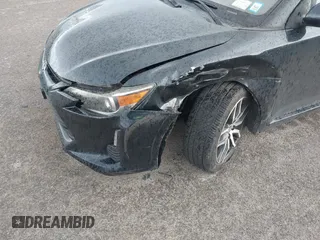 2015 Scion tC with VIN JTKJF5C7XFJ001662, listed as a IAAI auction lot 41843123 with 128,851 mi miles. Bid and sale history available at carsss.com. Image 6.