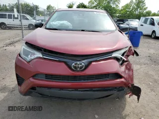 2018 Toyota RAV4 LE with VIN JTMBFREV2JD233808, listed as a Copart auction lot 59021235 with 71,430 mi miles and Salvage title. Bid and sale history available at DreamBid. Image 5.