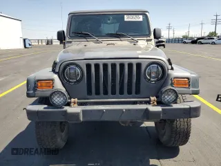 2003 Jeep Wrangler Sport z VIN 1J4FA49S43P327283, wystawiony jako Copart lot #59036295 z przebiegiem 158 108 mil mil oraz Szkoda całkowita • Salvage title. Historia ofert i sprzedaży dostępna na DreamBid. Obrazek 5.