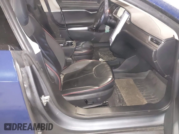 2014 Tesla Model S 60 with VIN 5YJSA1H1XEFP30497, listed as a IAAI auction lot 41294630 with 203,663 mi miles and . Bid and sale history available at DreamBid. Image 5.