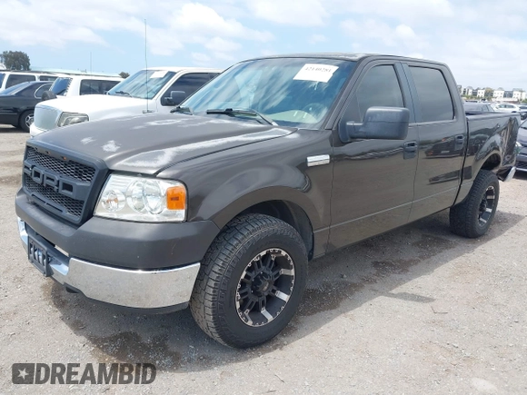 2005 Ford F-150 XLT with VIN 1FTPW12535KF05473, listed as a IAAI auction lot 42140281 with 163,023 mi miles. Bid and sale history available at carsss.com. Image 2.