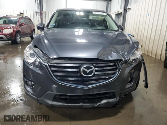 2016 Mazda CX-5 Touring z VIN JM3KE4CY5G0852073, wystawiony jako Copart lot #56599055 z przebiegiem 72 167 mil mil oraz Szkoda całkowita • Salvage title. Historia ofert i sprzedaży dostępna na DreamBid. Obrazek 5.