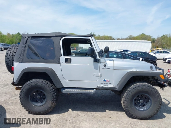 2003 Jeep Wrangler Sport z VIN 1J4FA49S73P302278, wystawiony jako IAAI lot #42219582 z przebiegiem 129 089 mil mil oraz . Historia ofert i sprzedaży dostępna na DreamBid. Obrazek 13.