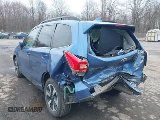 2018 Subaru Forester Limited with VIN JF2SJAJC4JH525104, listed as a IAAI auction lot 42018479 with 97,843 mi miles. Bid and sale history available at carsss.com. Image 3.