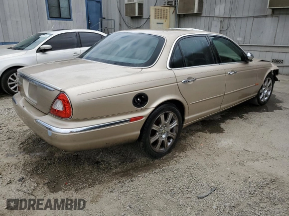 2004 Jaguar XJ with VIN SAJEA74C84SG03857, listed as a Copart auction lot 62156875 with 92,649 mi miles and Salvage title. Bid and sale history available at DreamBid. Image 3.