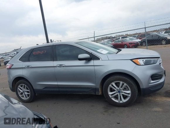 2022 Ford Edge SEL z VIN 2FMPK4J93NBA94793, wystawiony jako IAAI lot #41884687 z przebiegiem 57 372 mil mil oraz . Historia ofert i sprzedaży dostępna na DreamBid. Obrazek 13.