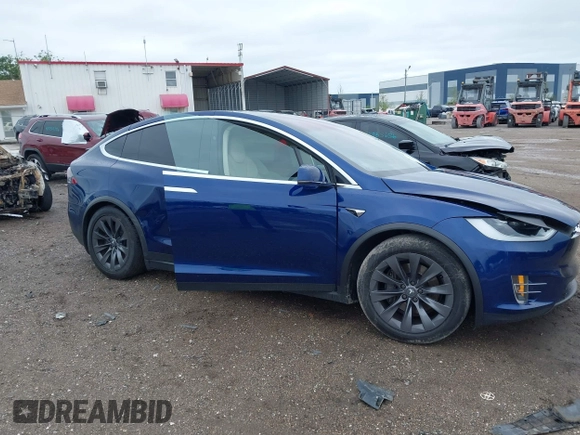 2018 Tesla Model X 75D with VIN 5YJXCAE2XJF111180, listed as a IAAI auction lot 41988079 with 114,593 mi miles and . Bid and sale history available at DreamBid. Image 13.