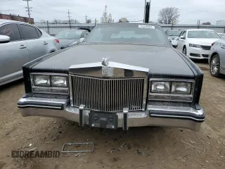 1985 Cadillac Eldorado z VIN 1G6EL5782FE634074, wystawiony jako Copart lot #44520964 z przebiegiem 74 425 mil mil oraz Szkody całkowita. Historia ofert i sprzedaży dostępna na DreamBid. Obrazek 5.