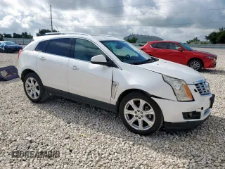 2014 Cadillac SRX Performance Collection with VIN 3GYFNCE39ES687733, listed as a Copart auction lot 62770665 with 151,714 mi miles and Salvage title. Bid and sale history available at DreamBid. Image 4.
