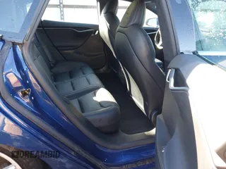2020 Tesla Model S Long Range with VIN 5YJSA1E26LF410779, listed as a IAAI auction lot 41241192 with 68,764 mi miles and . Bid and sale history available at DreamBid. Image 8.