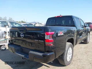 2024 Nissan Frontier SV with VIN 1N6ED1FK2RN603585, listed as a IAAI auction lot 42771501 with 8,818 mi miles and . Bid and sale history available at DreamBid. Image 4.
