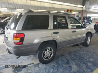 2003 Jeep Grand Cherokee Laredo with VIN 1J4GW48S43C567559, listed as a Copart auction lot 61431595 with 249,998 mi miles and Salvage title. Bid and sale history available at DreamBid. Image 3.