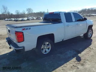 2018 Chevrolet Silverado 1500 LT with VIN 1GCVKREC5JZ350034, listed as a IAAI auction lot 41649277 with 112,673 mi miles. Bid and sale history available at carsss.com. Image 4.