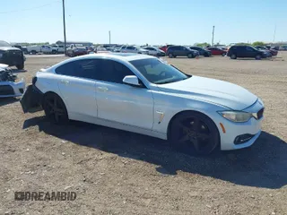 2015 BMW 4 Series 428i with VIN WBA4A5C52FD410252, listed as a IAAI auction lot 41748141 with 196,478 mi miles and . Bid and sale history available at carsss.com. Image 1.