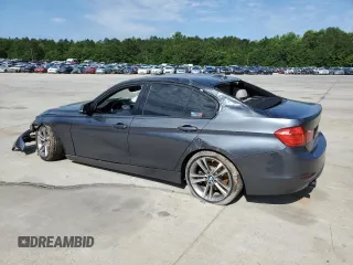 2012 BMW 3 Series 335i with VIN WBA3A9C5XCF474803, listed as a Copart auction lot 57940675 with 121,960 mi miles and Salvage title. Bid and sale history available at DreamBid. Image 2.