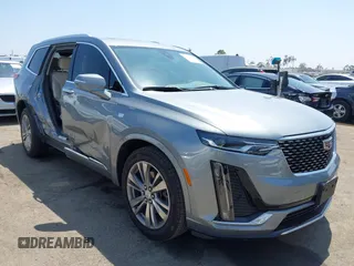 2023 Cadillac XT6 FWD Premium Luxury with VIN 1GYKPCRS6PZ163018, listed as a IAAI auction lot 42437403 with 21,366 mi miles and . Bid and sale history available at DreamBid. Image 1.