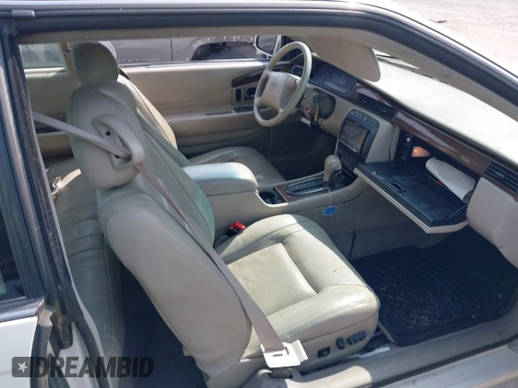 2000 Cadillac Eldorado Touring ETC z VIN 1G6ET129XYU162451, wystawiony jako IAAI lot #42412406 z przebiegiem 89 413 mil mil oraz . Historia ofert i sprzedaży dostępna na DreamBid. Obrazek 5.