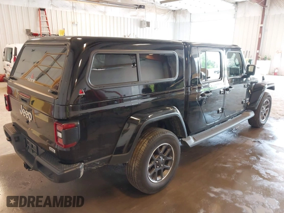 2020 Jeep Gladiator Overland with VIN 1C6HJTFG5LL140142, listed as a IAAI auction lot 42452310 with 111,884 mi miles and . Bid and sale history available at DreamBid. Image 4.