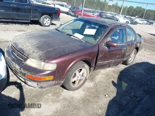 1998 Nissan Maxima GXE z VIN JN1CA21A0WT402950, wystawiony jako IAAI lot #41825084 z przebiegiem 244 042 mil mil oraz . Historia ofert i sprzedaży dostępna na DreamBid. Obrazek 2.