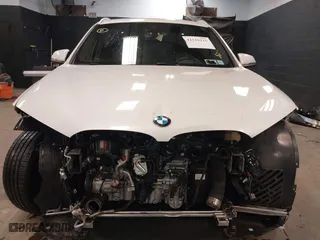 2021 BMW X1 xDrive28i with VIN WBXJG9C0XM5T76975, listed as a IAAI auction lot 41310115 with 26,869 mi miles. Bid and sale history available at carsss.com. Image 13.