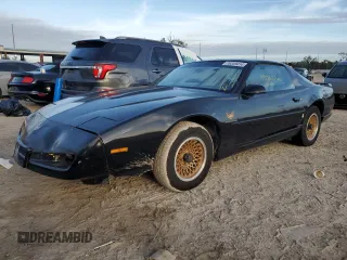 1992 Pontiac Firebird z VIN 1G2FS23T0NL203325, wystawiony jako Copart lot #76359414 z przebiegiem 198 651 mil mil oraz Nie do naprawy • Non repairable. Historia ofert i sprzedaży dostępna na DreamBid. Obrazek 1.